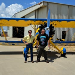 Coastal Biplane Tours - My husband and the pilot in front of the plane.
