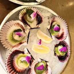 Raw Scallops $21 Half Dozen Peruvian Scallops on the half shell with house green sauce Raw Scallops $21 Half Dozen Peruvian Scallops on the half shell with house green sauce