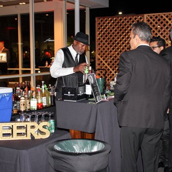 OCLA Events - Backside of the lattice panels and linen covered trash cans - Party & Event Planning Near Me OCLA Events - Backside of the lattice panels and linen covered trash cans - Party & Event Planning Near Me