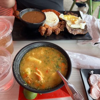 Sabor Y Arte 1 - a bowl of soup and a plate of meat - Colombian Near Me - Elizabeth, New Jersey Sabor Y Arte 1 - a bowl of soup and a plate of meat - Colombian Near Me - Elizabeth, New Jersey