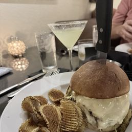 Burger and waffle fries with a lemon drop martini. Burger and waffle fries with a lemon drop martini.