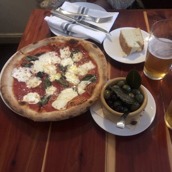 Uva Enoteca - Happy hour Margherita Pizza, olives, bread, and beer - Italian Near Me - San Francisco, California Uva Enoteca - Happy hour Margherita Pizza, olives, bread, and beer - Italian Near Me - San Francisco, California