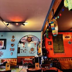 Cholo's Homestyle Mexican Restaurant - Decor from Mexico, collected by the owner Nancy.  She hangs them for display in the restaurant and items are for sale.