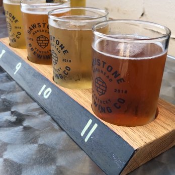 Sawstone Brewing - a flight of beers on a table - Breweries Near Me - Morehead, Kentucky