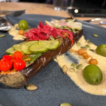 Parche - Berenjena Arabe: roasted eggplant, tamarind jus, tahini, castelvetrano olives, pickles pepper - Colombian Near Me - Oakland, California Parche - Berenjena Arabe: roasted eggplant, tamarind jus, tahini, castelvetrano olives, pickles pepper - Colombian Near Me - Oakland, California