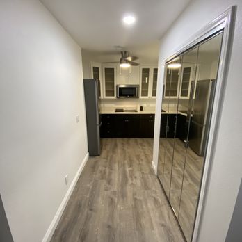 John Christopher Construction & Remodel - a hallway leading to a kitchen - General Contractors Near Me - Costa Mesa, California