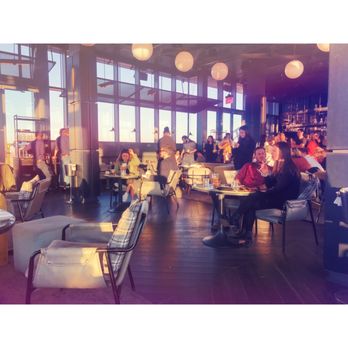 Westlight - Inside area, tables against the windows for the view and bar the far right. With a cozy little couch area in the middle. - Tapas/Small Plates Near Me - Brooklyn, New York