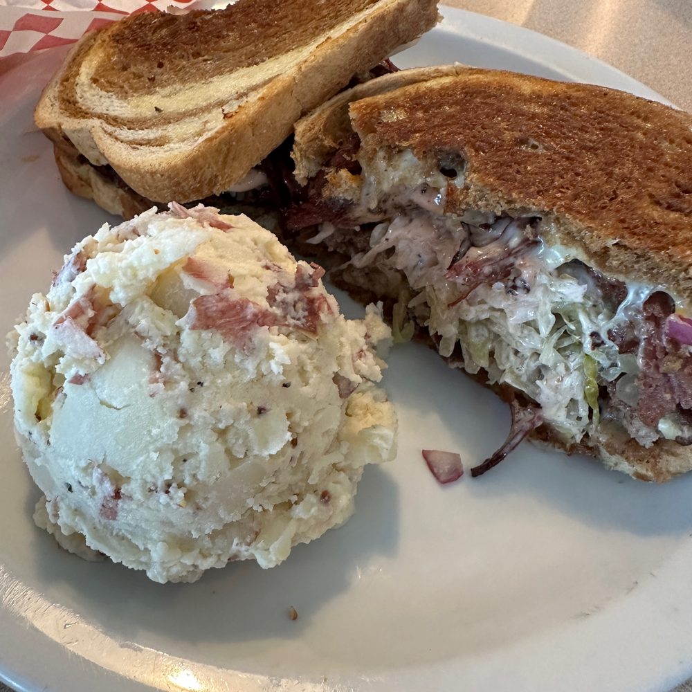 Mike's at the Crossroads - Moo-Ben: corned beef, swiss, sauerkraut on marbled rye with potato salad - American Near Me - Cotati, California