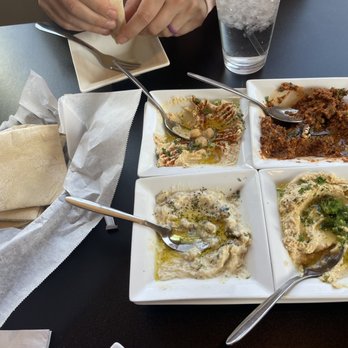 Hummus Cafe - Hummus Sampler appetizer: paprika, baba-gahnooj, jalapeño, and muhammara, fresh warm pita - Mediterranean Near Me - Oklahoma City, Oklahoma Hummus Cafe - Hummus Sampler appetizer: paprika, baba-gahnooj, jalapeño, and muhammara, fresh warm pita - Mediterranean Near Me - Oklahoma City, Oklahoma