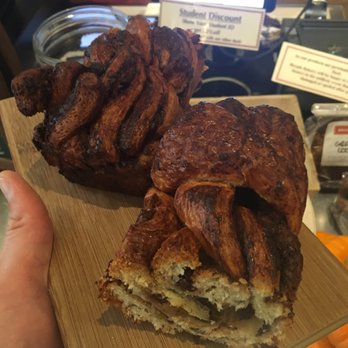 Breads Bakery - Union Square - BIG chocolate babka, sliced in half and plated on a wood block. - Bakeries Near Me - New York, New York