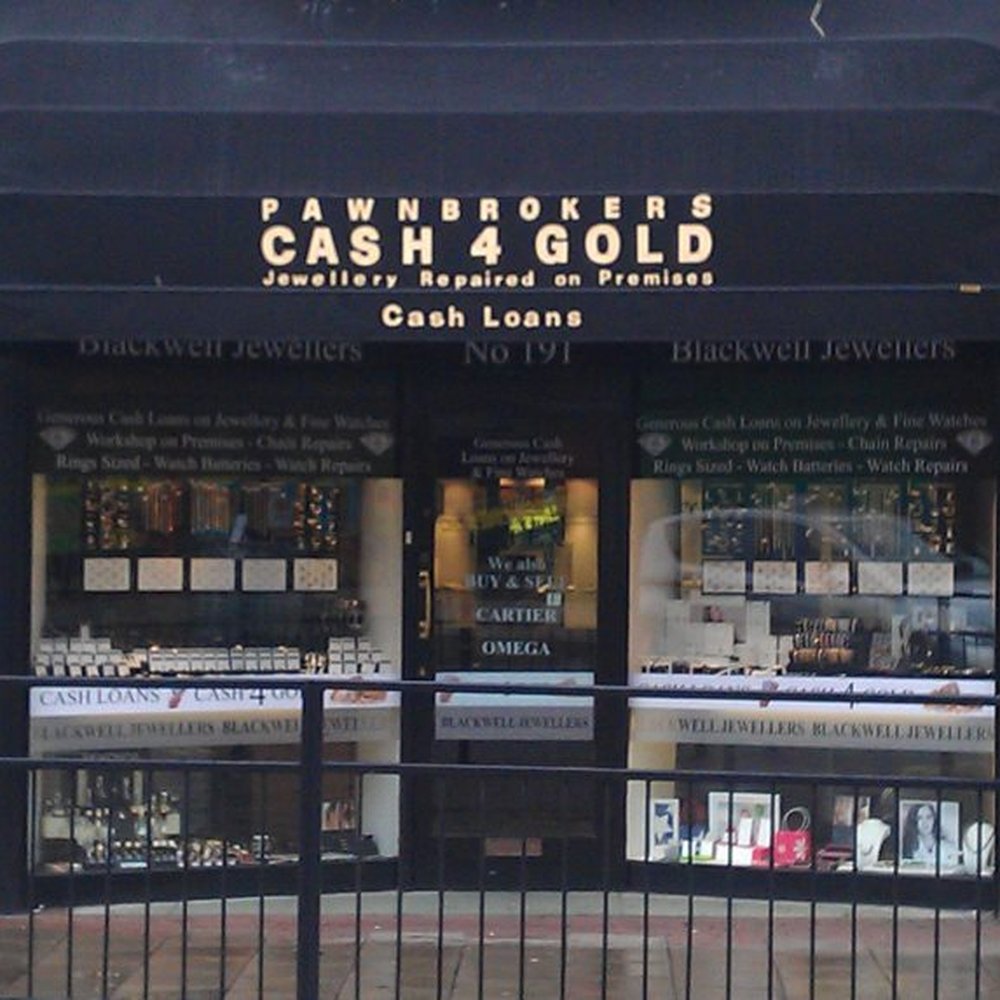 Pawn shop storefront with We Buy Gold signage