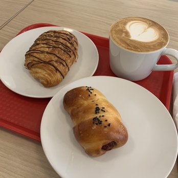 Creamy Rainbow Bakery and Cafe - Chocolate croissant, sausage bun, and a latte - Bakeries Near Me - Halifax, Nova Scotia