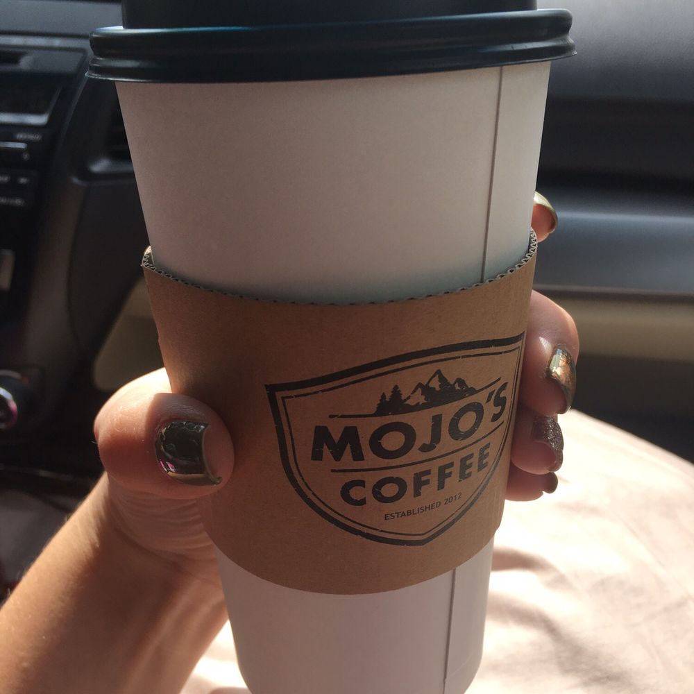 Mojo's Coffee - a person holding a coffee cup - Coffee & Tea Near Me - Bonners Ferry, Idaho Mojo's Coffee - a person holding a coffee cup - Coffee & Tea Near Me - Bonners Ferry, Idaho