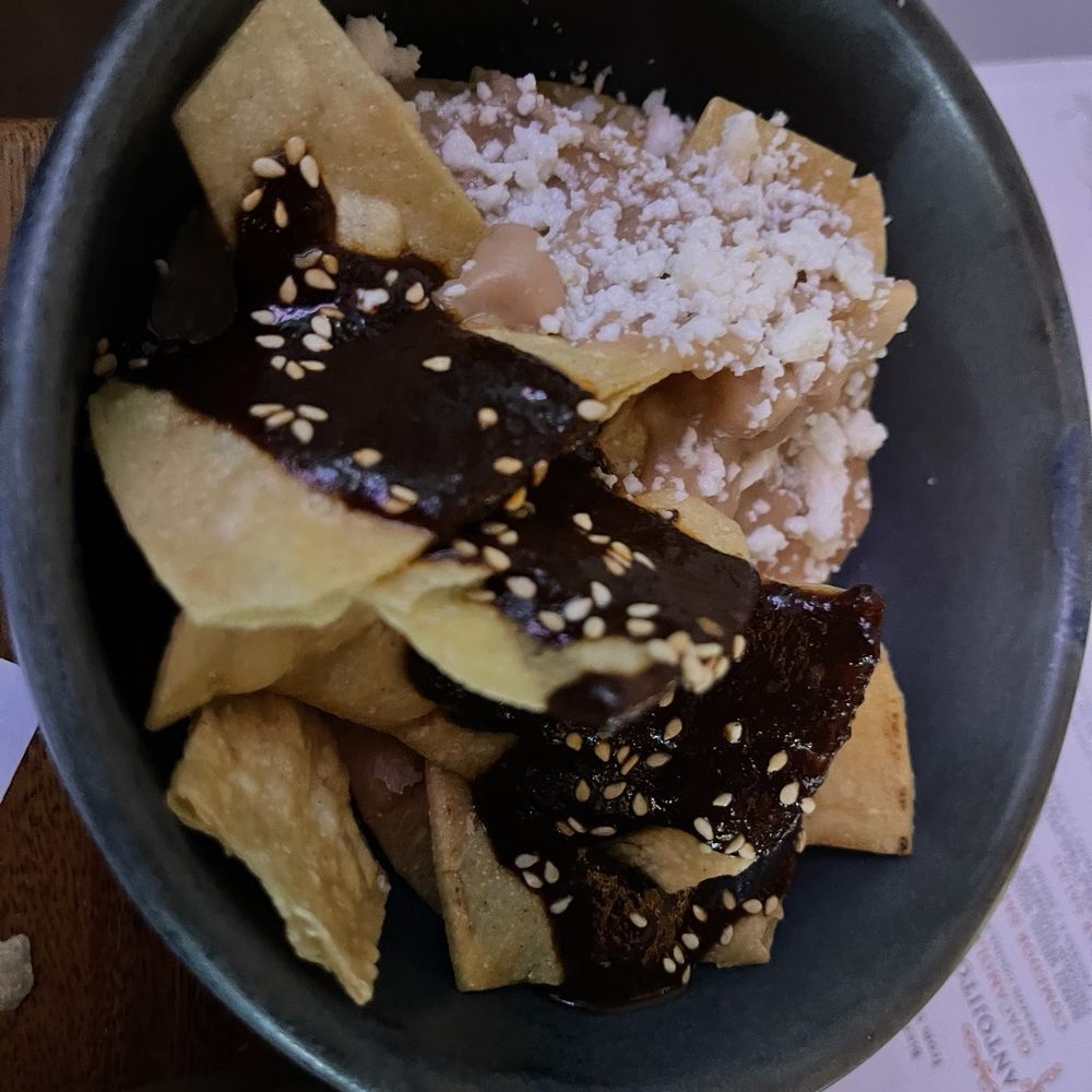 Corazon Comedor - Mole sauce and cheese sprinkle over tortilla chips - Mexican Near Me - Santa Barbara, California Corazon Comedor - Mole sauce and cheese sprinkle over tortilla chips - Mexican Near Me - Santa Barbara, California