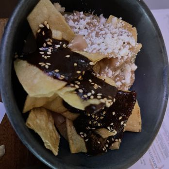 Corazon Comedor - Mole sauce and cheese sprinkle over tortilla chips - Mexican Near Me - Santa Barbara, California