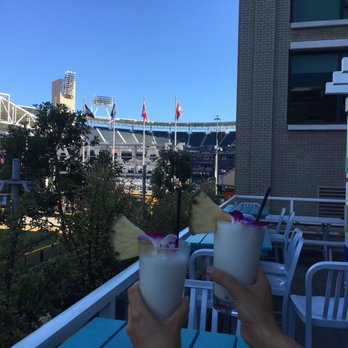 Fairweather Rooftop Bar - 2 pina coladas, one for each hand - Tiki Bars Near Me - San Diego, California Fairweather Rooftop Bar - 2 pina coladas, one for each hand - Tiki Bars Near Me - San Diego, California