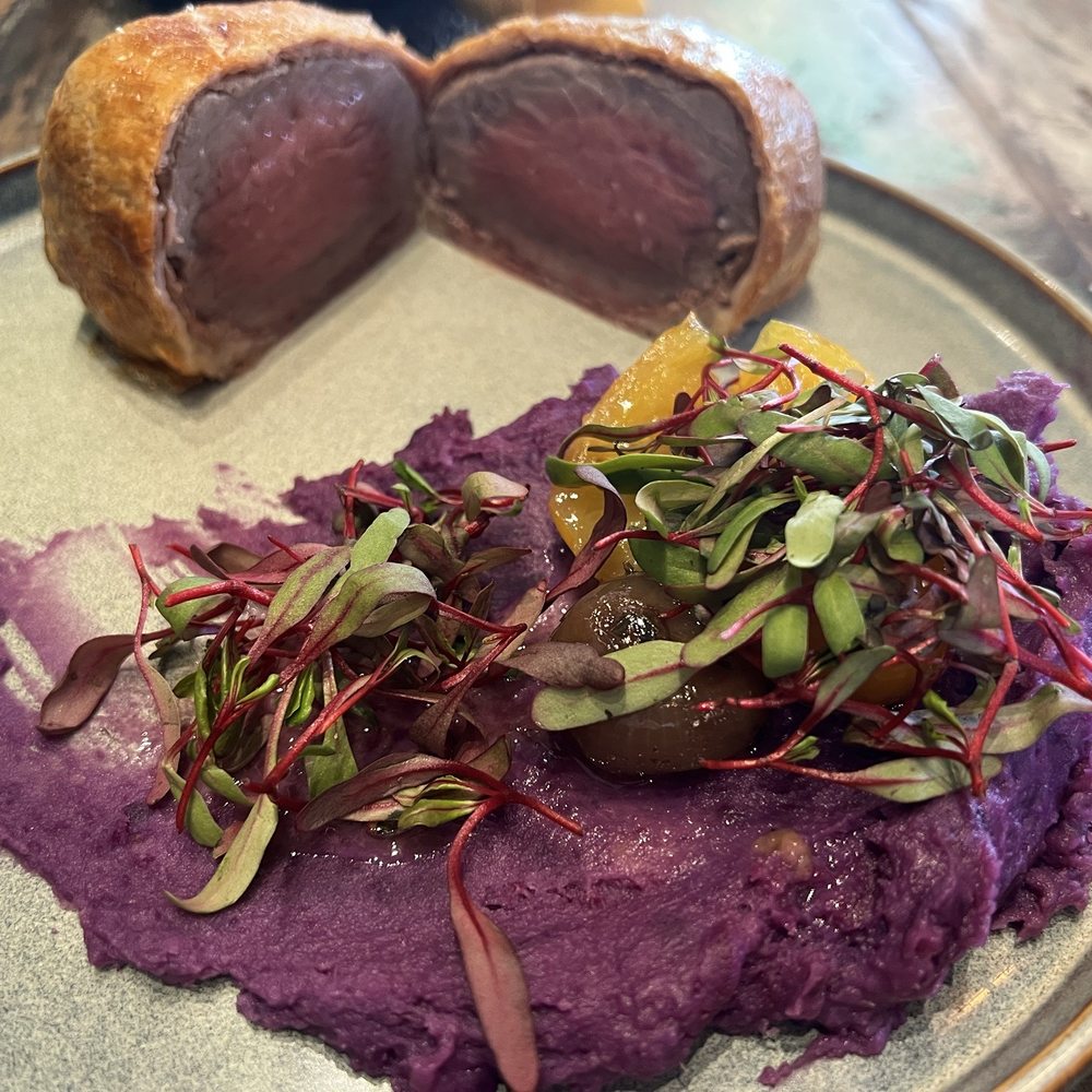 Luca Turci - Beef Wellington served medium rare, accompanied by purple sweet potato purée - Italian Near Me - Winter Park, Florida Luca Turci - Beef Wellington served medium rare, accompanied by purple sweet potato purée - Italian Near Me - Winter Park, Florida