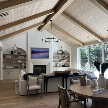 Round Table Carpentry - Furnished photo of white oak cathedral beams with tongue and groove ceiling white oak arch beam and white oak floating shelves - Carpenters Near Me Round Table Carpentry - Furnished photo of white oak cathedral beams with tongue and groove ceiling white oak arch beam and white oak floating shelves - Carpenters Near Me