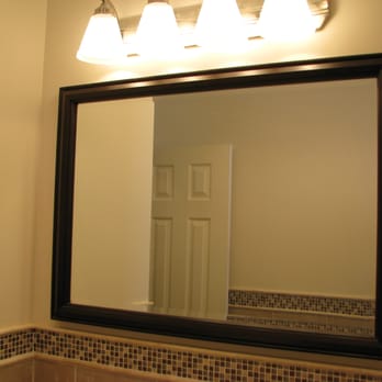Best Contracting - a bathroom with a mirror and lights - General Contractors Near Me - Staten Island, New York