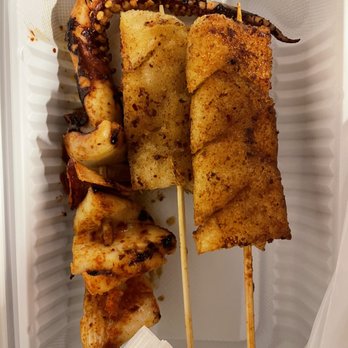 Lan Zhou Handmade Noodle - Barbecued squid skewer ($3), rice cake skewers (2 per order, $3) - Noodles Near Me - Flushing, New York Lan Zhou Handmade Noodle - Barbecued squid skewer ($3), rice cake skewers (2 per order, $3) - Noodles Near Me - Flushing, New York