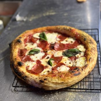 Point of Fire Pizza - Neapolitan style pizza- tomato sauce, mozzarella cheese, pepperoni, hot, honey, drizzle and basil. "The Fughgeddaboudit" - Pizza Near Me - McAllen, Texas Point of Fire Pizza - Neapolitan style pizza- tomato sauce, mozzarella cheese, pepperoni, hot, honey, drizzle and basil. "The Fughgeddaboudit" - Pizza Near Me - McAllen, Texas