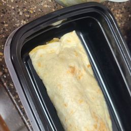 Steak burrito and side salad. Steak burrito and side salad.