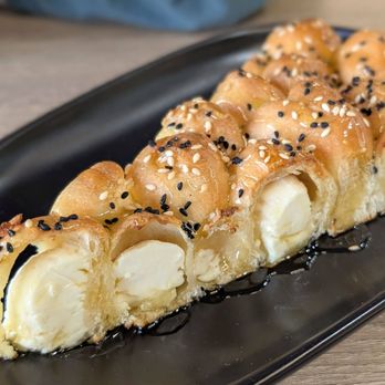 Moka & Co - Bee bites, this was so good, cheese inside with honey drizzled on top - Coffee & Tea Near Me - Fremont, California Moka & Co - Bee bites, this was so good, cheese inside with honey drizzled on top - Coffee & Tea Near Me - Fremont, California