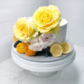 A Cake Addict - Lemon Cake with blueberry filling and white buttercream. (Flowers and decorated by florist) - Custom Cakes Near Me - Houston, Texas