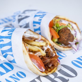 Nick The Greek - two pita sandwiches wrapped in paper - Greek Near Me - Newport Beach, California Nick The Greek - two pita sandwiches wrapped in paper - Greek Near Me - Newport Beach, California