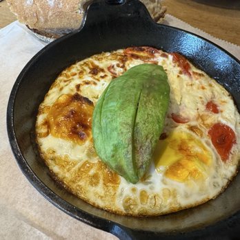 Le Pain Quotidien - Skillet baked eggs with feta, tomato and avocado - Bakeries Near Me - Fairfax, Virginia Le Pain Quotidien - Skillet baked eggs with feta, tomato and avocado - Bakeries Near Me - Fairfax, Virginia