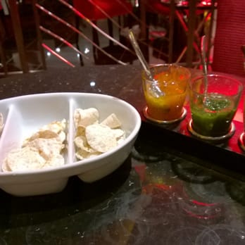 Madhu's Heathrow - starter of pappadam with three flavors and three chutneys - Indian Near Me - Gt Lon, XGL Madhu's Heathrow - starter of pappadam with three flavors and three chutneys - Indian Near Me - Gt Lon, XGL