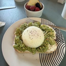 Avocado toast with an added poached egg. Avocado toast with an added poached egg.