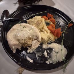 Stuffed flounder with crab meat, mashed potatoes and carrots