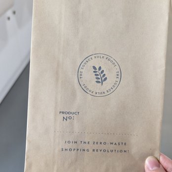 The Source Bulk Foods - a person holding a brown paper bag - Specialty Food Near Me - Vancouver, British Columbia The Source Bulk Foods - a person holding a brown paper bag - Specialty Food Near Me - Vancouver, British Columbia