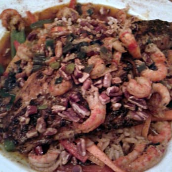 Louisianne's - Deboned pecan catfish with crawfish BBQ on top, on a bed of heavenly rice. Check out that ring of oil in the dish. - Cajun/Creole Near Me - Middleton, Wisconsin Louisianne's - Deboned pecan catfish with crawfish BBQ on top, on a bed of heavenly rice. Check out that ring of oil in the dish. - Cajun/Creole Near Me - Middleton, Wisconsin