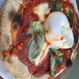 Margherita pizza with burrata and spicy chili honey Margherita pizza with burrata and spicy chili honey