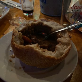 O' Choppers - Irish stew in a bread bowl that I'm dipping in the wonderful sauce. The beef is so tender! - Pubs Near Me - Orange Beach, Alabama O' Choppers - Irish stew in a bread bowl that I'm dipping in the wonderful sauce. The beef is so tender! - Pubs Near Me - Orange Beach, Alabama