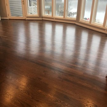 Costa Floors - a hardwood floor in a living room - Flooring Near Me Costa Floors - a hardwood floor in a living room - Flooring Near Me