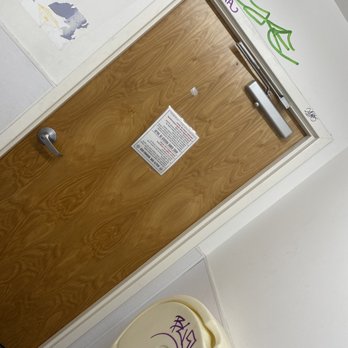 CVS Pharmacy - a toilet with graffiti on the door - Drugstores Near Me - HOUSTON, Texas