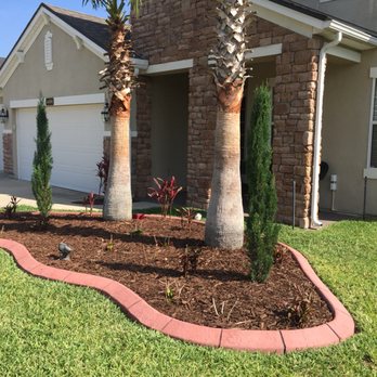 All American Curbing  - Here our red mixed concrete was stamped with a slate texture and sectional stamp line every 18" - Landscaping Near Me - St. Augustine, Florida