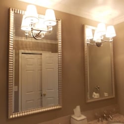 Framed - Mirrors made to go over a double sink with holes for the light fixture.