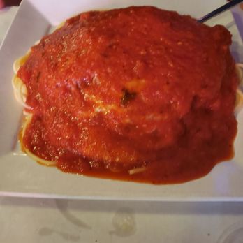 Cucina Bella - Veal Parmigiana over pasta - Italian Near Me - Algonquin, Illinois Cucina Bella - Veal Parmigiana over pasta - Italian Near Me - Algonquin, Illinois