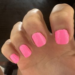 Rushed manicure, messy and uneven.