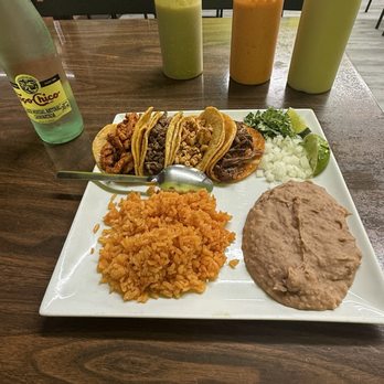 Los Parrilleros - Four taco plate meal: al pastor, fajita, chicken, birria queso. Comes with rice and beans, lime, onion, cilantro on side. - Tacos Near Me - Rowlett, Texas Los Parrilleros - Four taco plate meal: al pastor, fajita, chicken, birria queso. Comes with rice and beans, lime, onion, cilantro on side. - Tacos Near Me - Rowlett, Texas