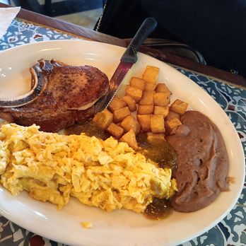 Camila's Mexican Restaurant - Scrambled eggs with pork chop and beans potatoes - Mexican Near Me - San Antonio, Texas Camila's Mexican Restaurant - Scrambled eggs with pork chop and beans potatoes - Mexican Near Me - San Antonio, Texas