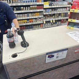 a man filling a bottle of soda into a machine a man filling a bottle of soda into a machine