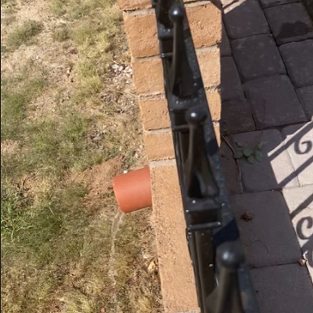 Action Yard and Tree Service - Water from underground pouring out of the downspout on the other side of our wall - Tree Services Near Me - Tucson, Arizona Action Yard and Tree Service - Water from underground pouring out of the downspout on the other side of our wall - Tree Services Near Me - Tucson, Arizona