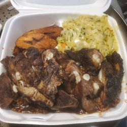 Irie Jerk Hut - Rib Tip Dinner - comes w/2 sides. I choose plantains and cabbage. Rice & Beans underneath. Not pictured: side of bbq sauce. Meaty & so good!