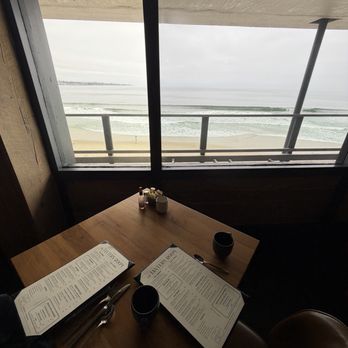 The Lantern Room - Table by the window with an ocean view - American Near Me - Monterey, California