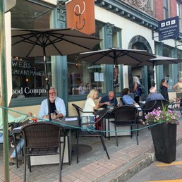 people sitting outside a restaurant